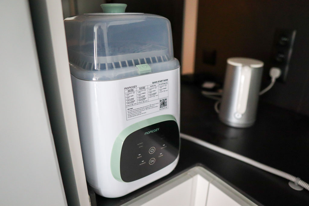 A photo of the Momcozy KleanPal Pro on the author's kitchen countertop.